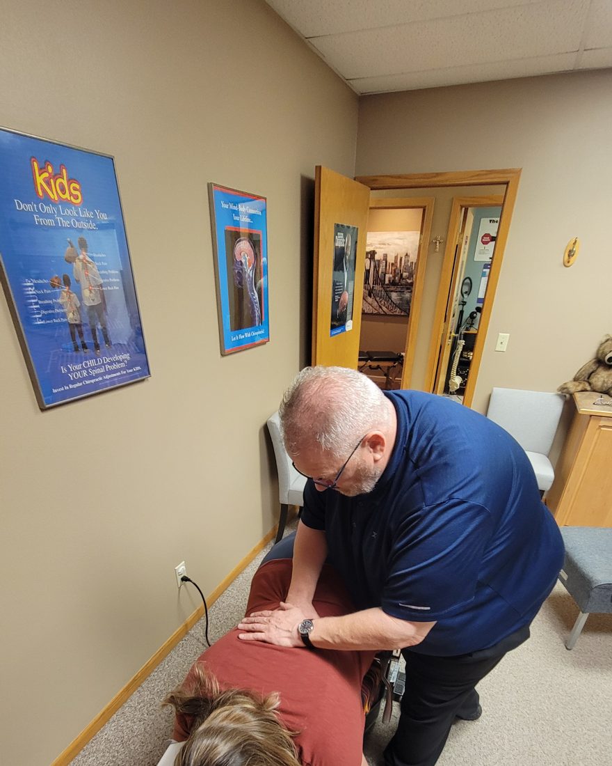Dr. Badinger delivering a specific chiropractic adjustment