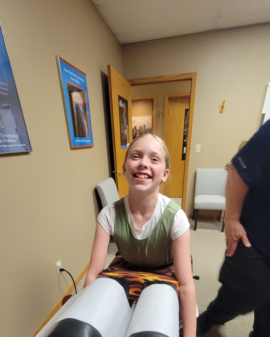 A young patient smiling during her visit